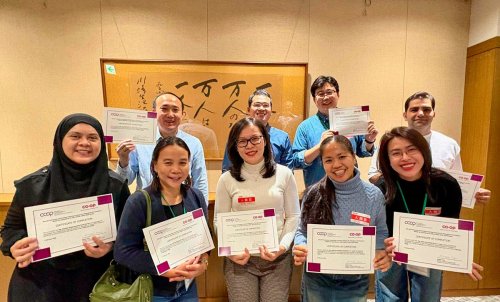 Trainees holding their certificates of completion_01.jpg