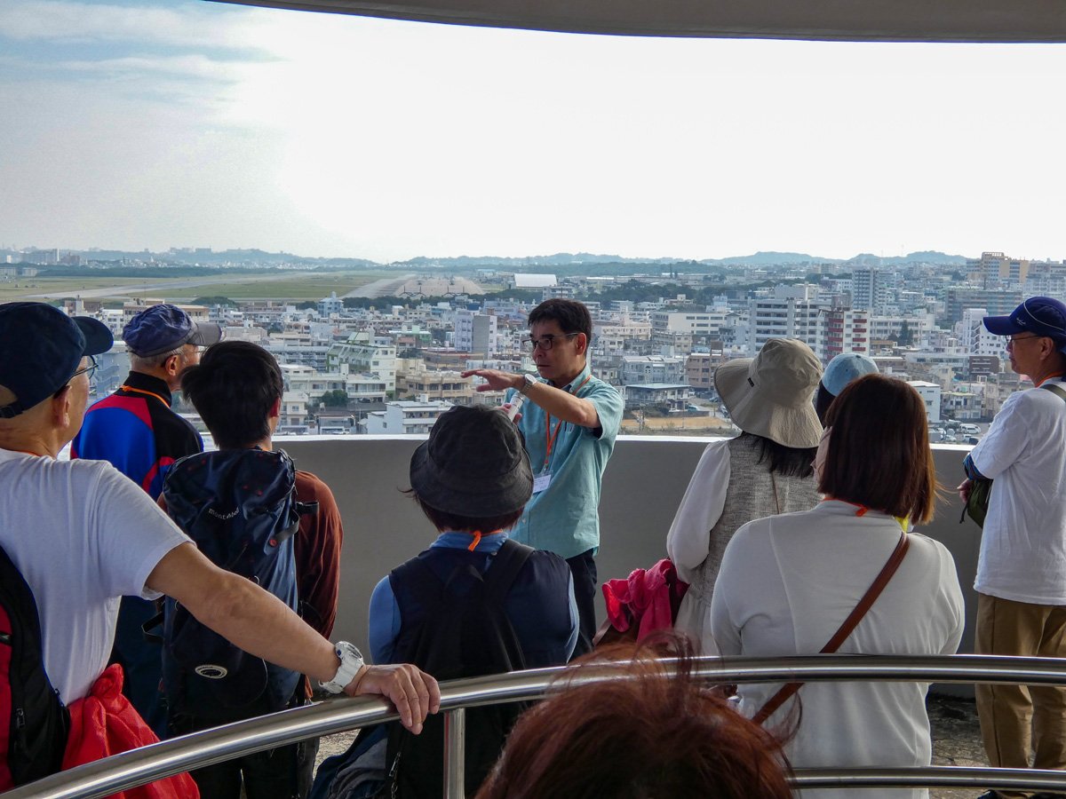 05_Participants receiving an explanation at Kakazu Hill.jpg