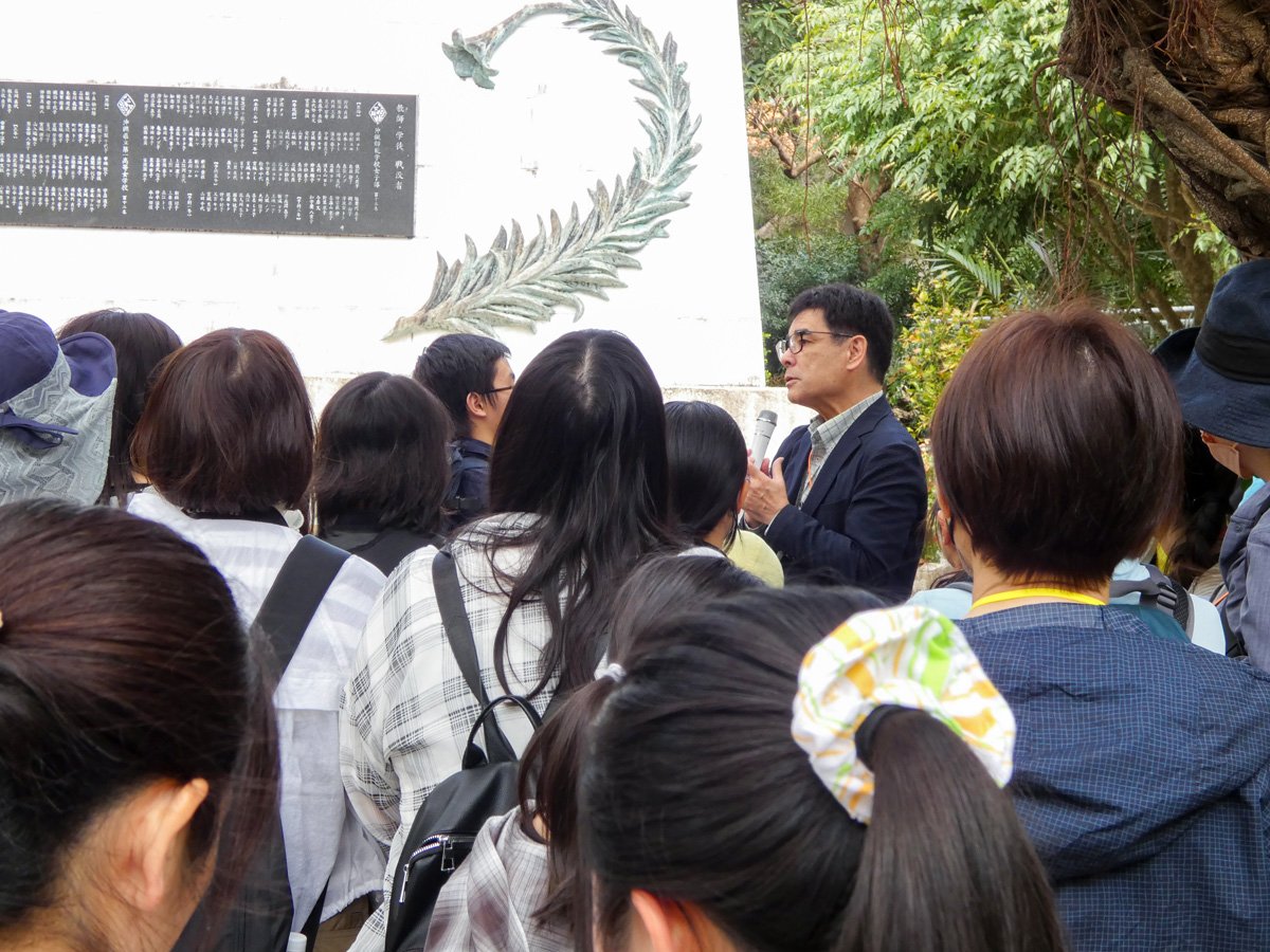 06_Participants receiving an explanation at the Himeyuri Tower.jpg