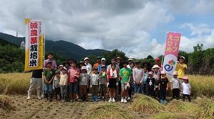 Participants pose for a group photo during CO-OP Ehime's harvest festival