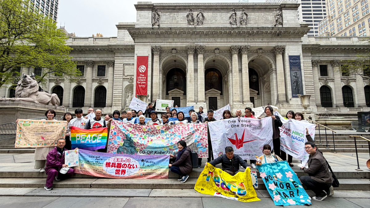 The co-op delegation holding a banner at the parade destination.jpg